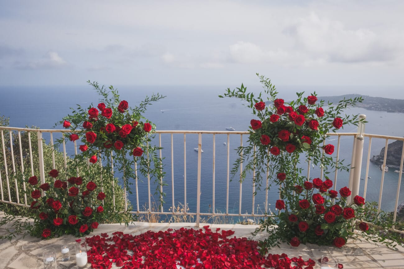 Chateau Chevre d'Or Eze, luxury proposal  With red roses floral setup in the private garden overlooking the French Riviera
French Riviera Proposal planning and Photography WildRoses