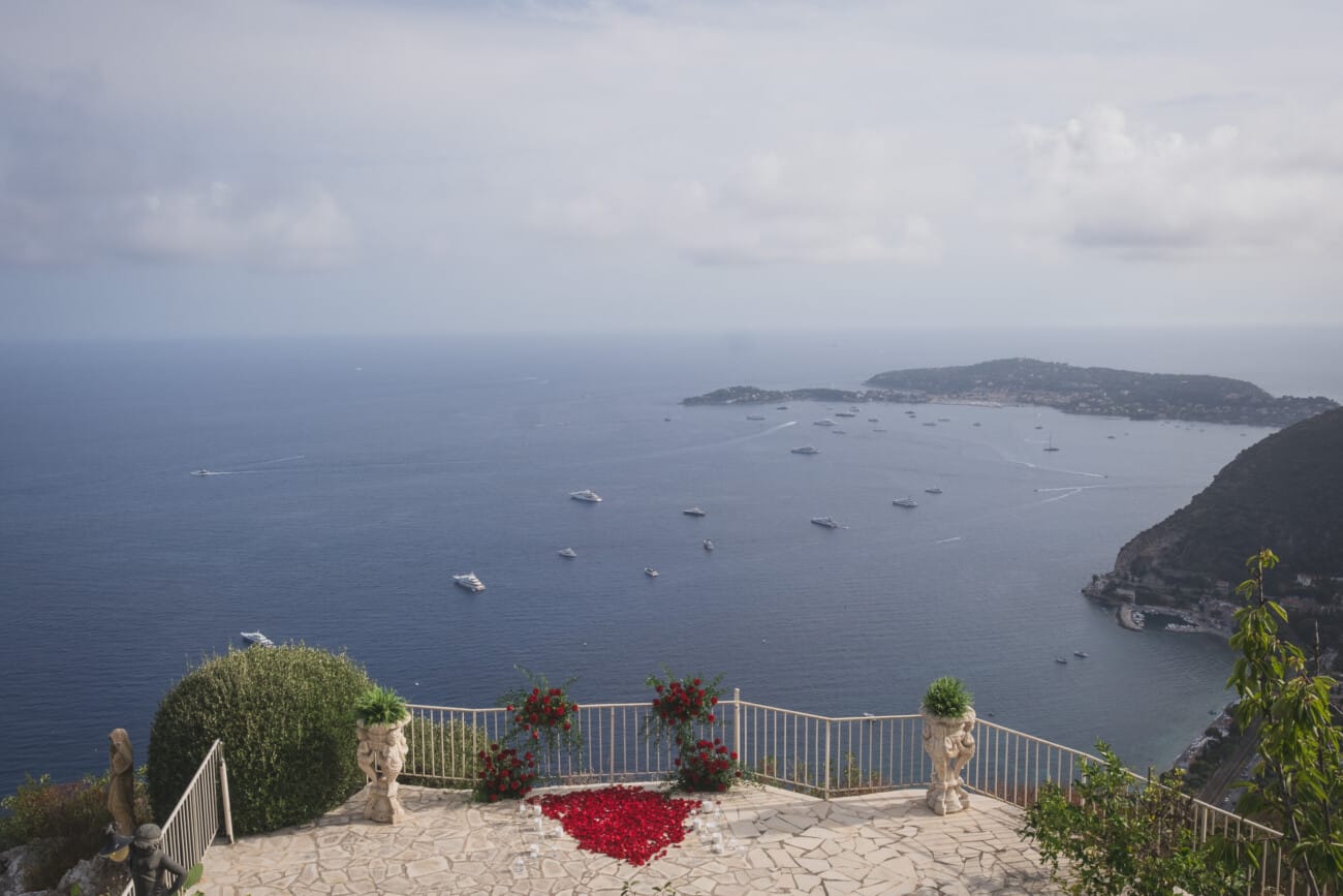 Chateau Chevre d'Or Eze, luxury proposal  With red roses floral setup in the private garden overlooking the French Riviera
French Riviera Proposal planning and Photography WildRoses