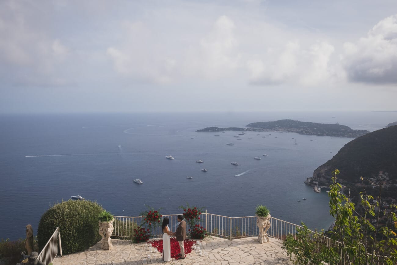 Chateau Chevre d'Or Eze, luxury proposal  With red roses floral setup in the private garden overlooking the French Riviera
French Riviera Proposal planning and Photography WildRoses