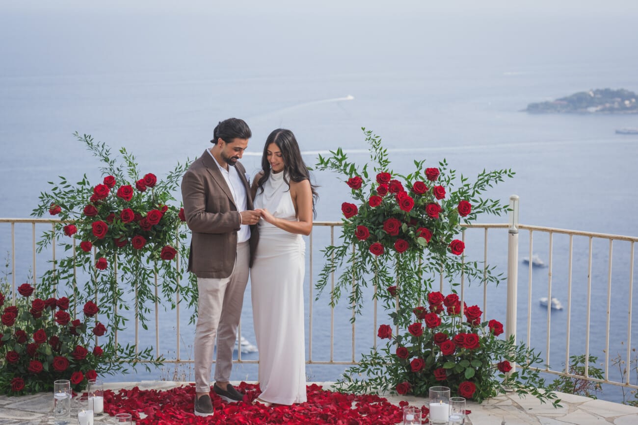 Chateau Chevre d'Or Eze, intimate proposal  With red roses floral setup in the private garden overlooking the French Riviera
French Riviera Proposal planning and Photography WildRoses