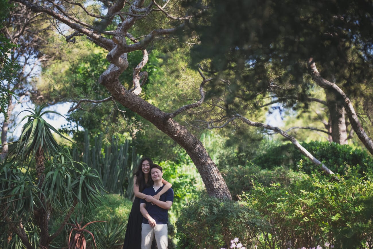 Intimate Morning Proposal at Villa Ephrussi de Rothschild 17 Hug under the pine tree after their morning proposal at villa Ephrussi