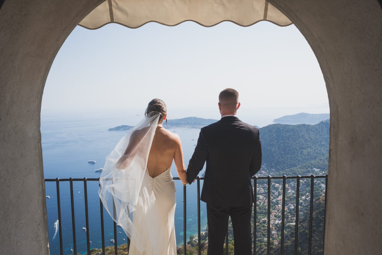 Intimate  Elopement ceremony exchanging vows overlooking the French Riviera coastline from Chateau Eza