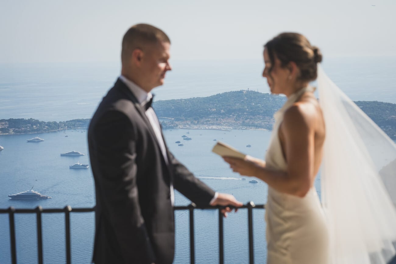 Intimate  Elopement ceremony exchanging vows overlooking the French Riviera coastline from Chateau Eza