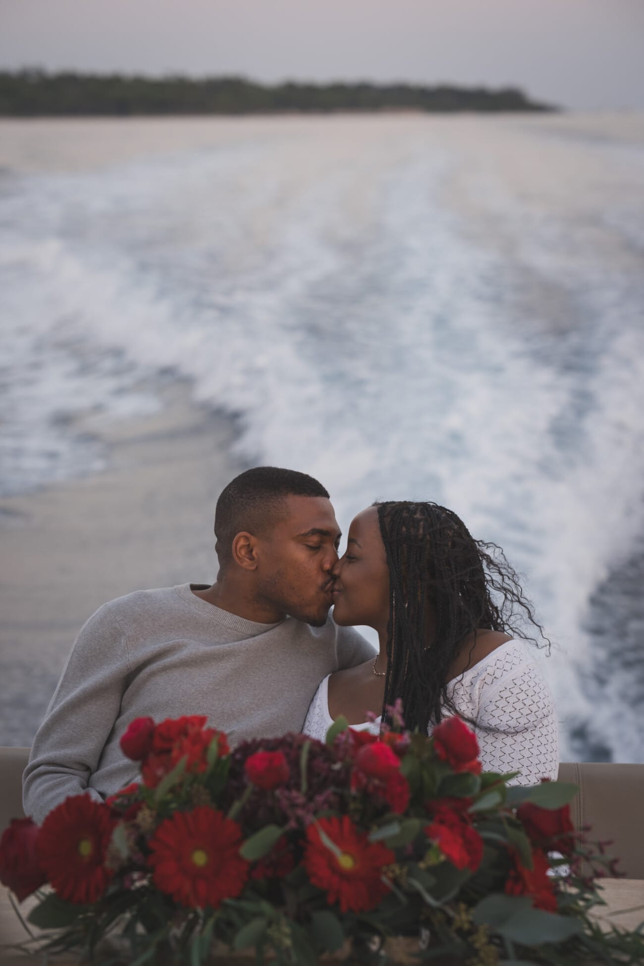 A Romantic Proposal on a Yacht between the Lérins Islands 26 Couple on yacht with floral arrangement.
after an intimate French Riviera Yacht proposal near Cannes.
Planning and Photography by WildRoses Studio.