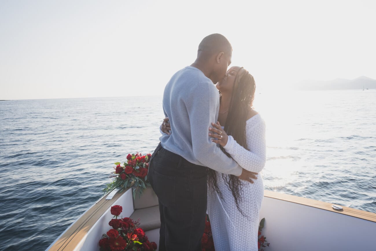 A Romantic Proposal on a Yacht between the Lérins Islands 11 First Kiss as an fiancés after their engagement on a Yacht.
French Riviera Proposal planning and Photography WildRoses Studio