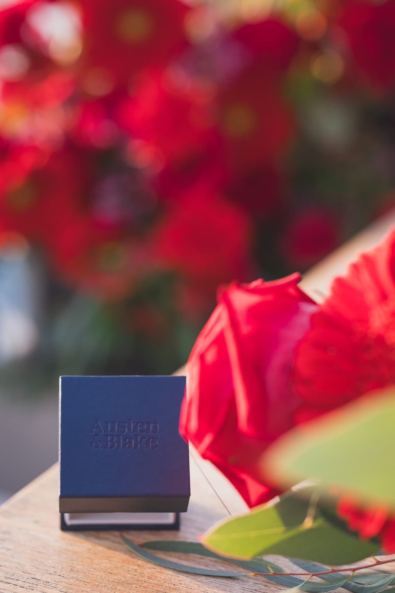 A Romantic Proposal on a Yacht between the Lérins Islands 18 Engagement ring box with red flowers
French Riviera Proposal planning and Photography WildRoses Studio