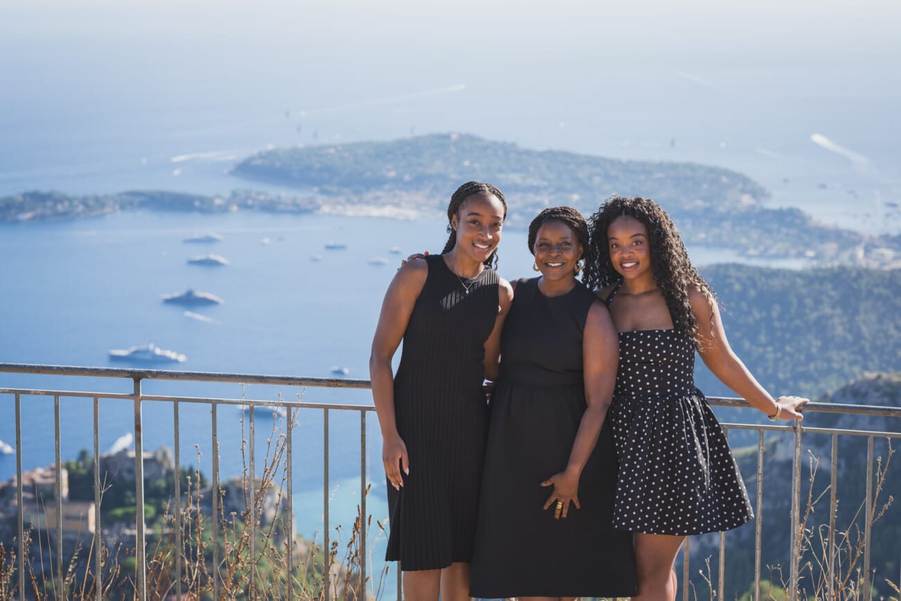 The Ultimate Girls’ Trip: A Mother and Daughters’ Legacy Session on the French Riviera 3 Wide shot of the trio walking through a natural park near Eze, showcasing the wild beauty of the French Riviera.