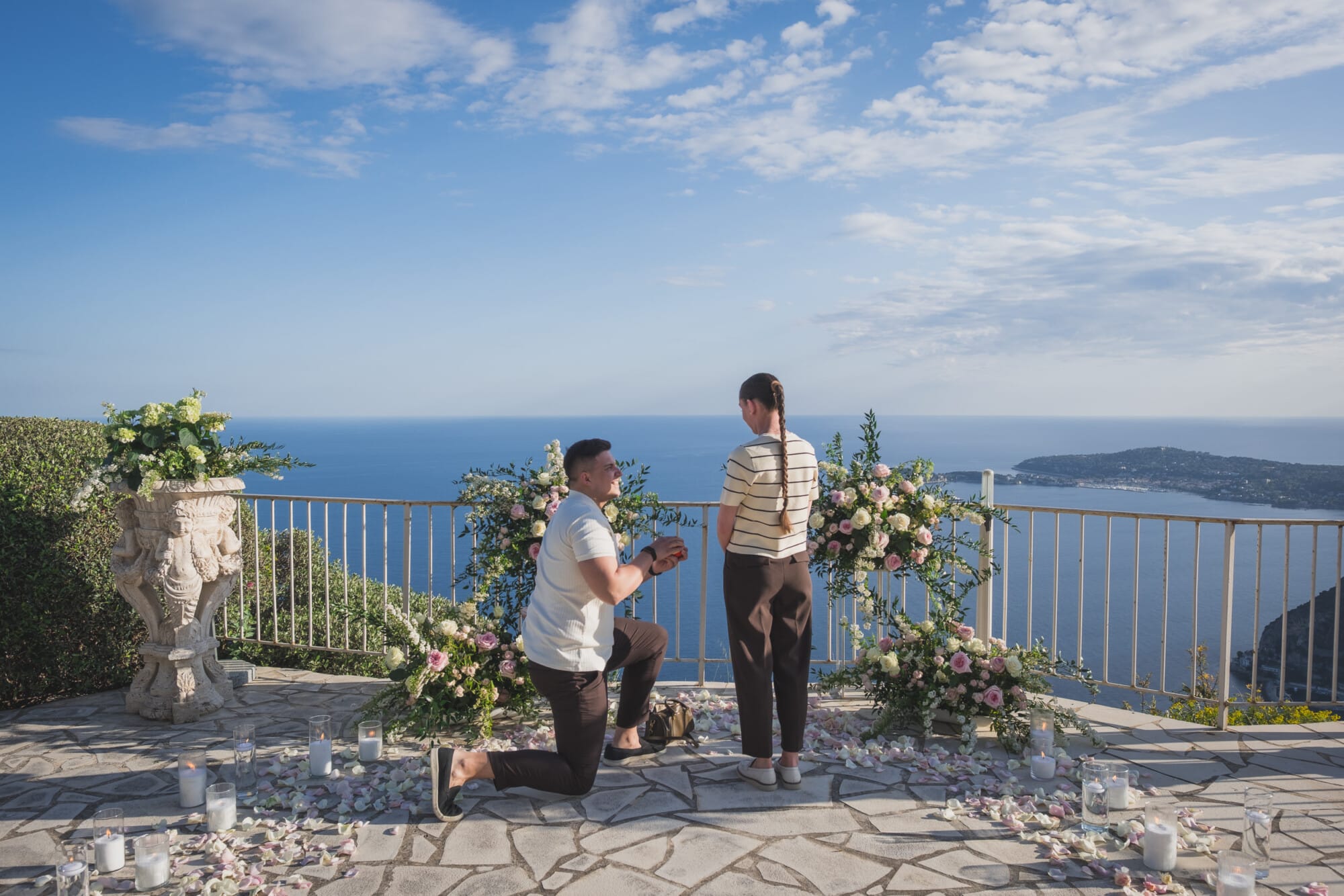 A Breathtaking Surprise Proposal at Château de la Chèvre d’Or, Eze | French Riviera 5 Eze Chateau Chevre d'or Proposal on one knee with floral decoration aroundProposal Planning & photography WildRoses